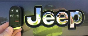 A jeep logo is shown on the side of a car.