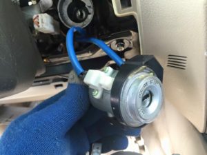 A blue hose is connected to the ignition switch.